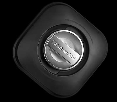SECURE, VENTED LID WITH INGREDIENT MEASURING CAP
